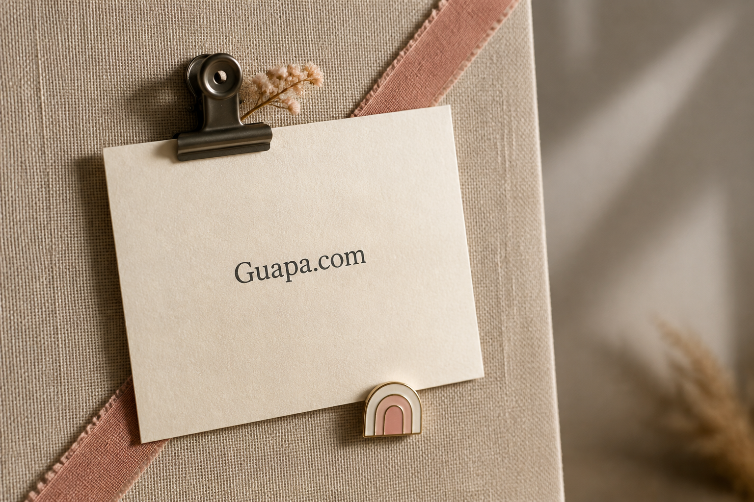 Guapa.com cream card and pressed flower on linen